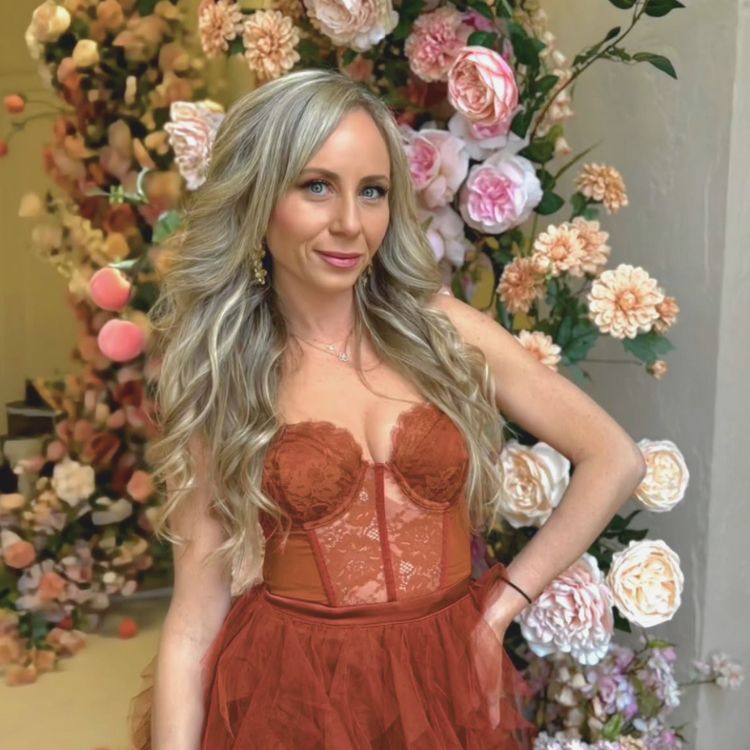 Elegant makeup styling with floral backdrop