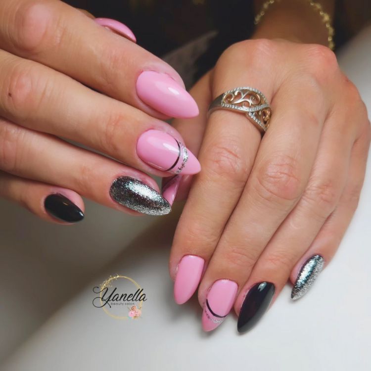 Pink and black nail art with silver accents